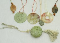 Seven modern jade and hard stone pendants,