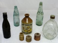 A collection of assorted stoneware inkwells, flagons, hot water bottles, etc.