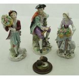 A pair of Sitzendorf figures of flower sellers with sheep,