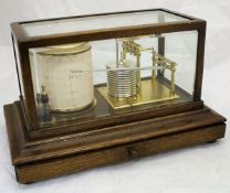 An oak cased barograph by T Barnard Optician Henley-on-Thames No'd.