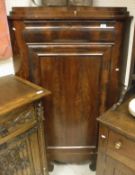 A 19th Century Continental figured mahogany corner cupboard in the Beidermeier taste with single