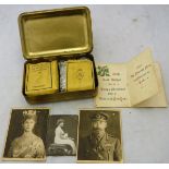 A embossed brass Mary Christmas box containing Christmas card, cigarettes,