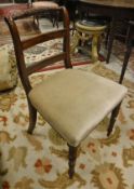 A set of six early 19th Century mahogany bar back dining chairs with upholstered seats on turned