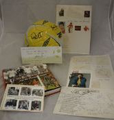 A collection of signed football memorabilia including an Umbro football signed by Pelé and Gordon