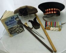 A collection militaria relating to the KOSB (The Kings Own Scottish Borders Regiment) comprising a