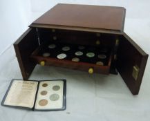 A small mahogany two door coin collectors cabinet and contents of various 17th to 19th Century