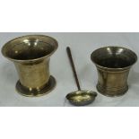 Two 18th Century bell metal mortars and a wooden handled white metal punch ladle,