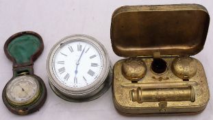 A Victorian leather covered gilt and brass travelling inkwell with two inkwells, candle and brush,