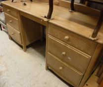 A "Stag" triple wardrobe together with another "Stag" triple wardrobe,