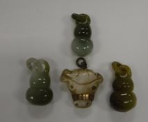 Three Chinese jade gourd shaped pendants and a yellow metal mounted carved mother of pearl "bull's