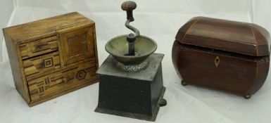 A 19th Century rosewood and inlaid tea caddy of bombé form,