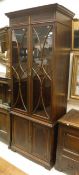 An Edwardian mahogany and inlaid bookcase cabinet,