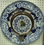 A circa 1900 Creil (Canadian) pottery wall plate clock, floral patterned,