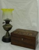 A late Victorian brass oil lamp with acid etched and yellow tinted shade,