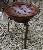 A modern firepit of small proportions with twin ring handles and studded decoration on stand*