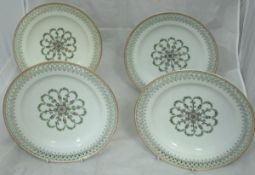 A set of four Berlin porcelain cabinet plates with central floral and foliate medallion decoration,