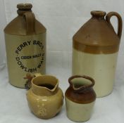 A collection of stoneware flagons and storage jars to include one inscribed "Perry Bros Cider Mills,