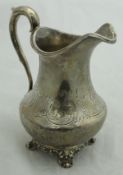 A Victorian silver baluster shaped jug with engraved decoration (London 1844) approx 6.