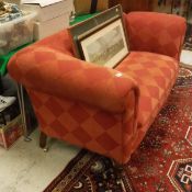An early 20th Century Chesterfield sofa with red diamond pattern upholstery to cabriole legs on