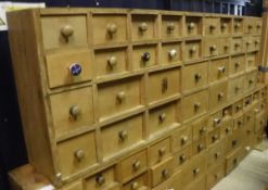 A pine bank of 34 Apothecary drawers