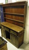 An oak Welsh dresser with two tier plate rack,