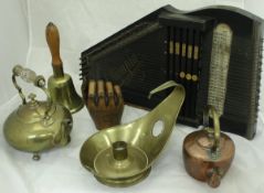 A collection of various fireside tools including bellows, toasting forks, brush,