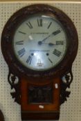 A Victorian carved walnut framed drop dial wall clock,