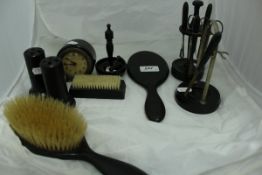 A quantity of ebony dressing table wares including brushes, candlesticks, tray, hatpin holders,