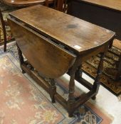 A oak drop leaf gate leg table