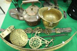 A copper kettle, miniature brass coal helmet, martingale and horse brasses, beer skimmer,