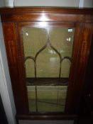 An Edwardian mahogany and inlaid display cabinet