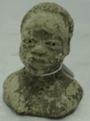 An early 20th Century sculpted clay head of an African woman with necklace