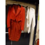 A red hunting tailcoat with Cotswold Hunt buttons,