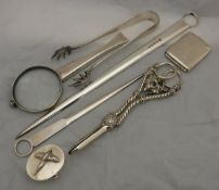 A French silver mounted magnifying glass, silver Vesta case, two plated skewers,