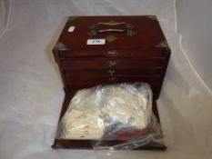 A teak-cased bone and bamboo mahjong set,