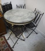 A modern distressed painted circular kitchen table together with four wrought iron garden chairs