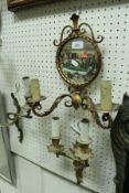 Three mirrored wall sconces,