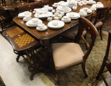 A Victorian mahogany extending dining table on turned and reeded legs to brass caps and castors