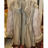 A grey mink lined full length coat CONDITION REPORTS The lining to the coat has