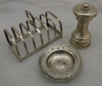 A silver six section toast rack,