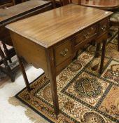 A mahogany dressing table with three drawers to square legs