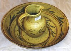 A foliate decorated glazed studio pottery jug and bowl