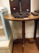 A mahogany circular tripod occasional table together with a carved mahogany wall bracket