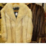 A white fox fur jacket bearing label inside inscribed 'Echter Pelz' together with a brown musquash