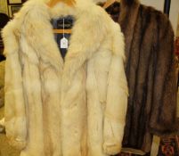 A white fox fur jacket bearing label inside inscribed 'Echter Pelz' together with a brown musquash