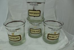 A set of six Cera drinking glasses, each inscribed "Name your poison", including Arsenic,