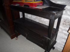 An Edwardian mahogany buffet and a nest of three occasional tables