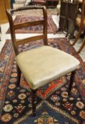 A set of five early 19th Century mahogany bar back dining chairs with upholstered seats on turned