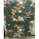 A pair of glazed cotton dark green ground floral decorated interlined curtains with tape gathered