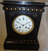 A black slate cased mantle clock with painted decoration